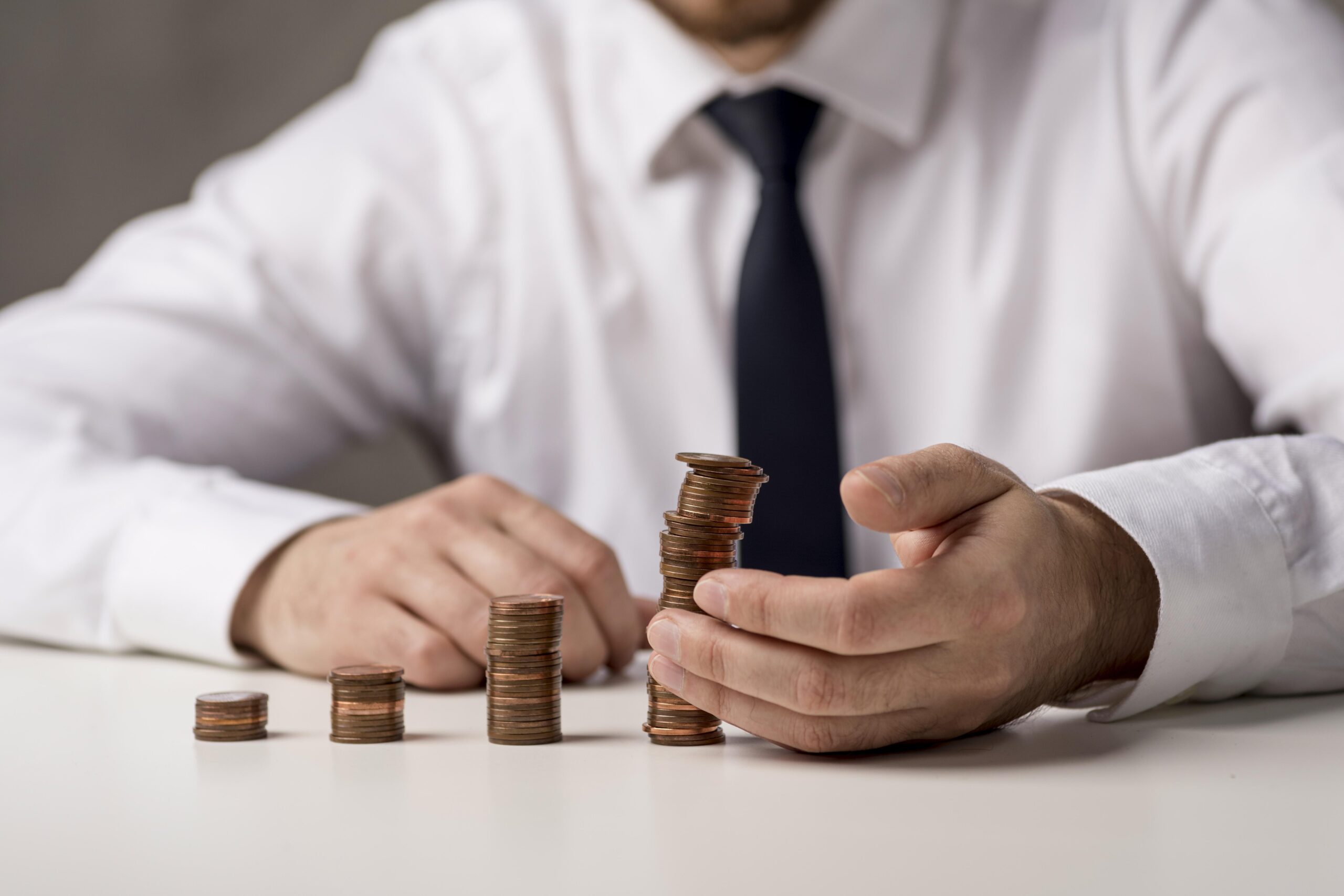 front view businessman with coins