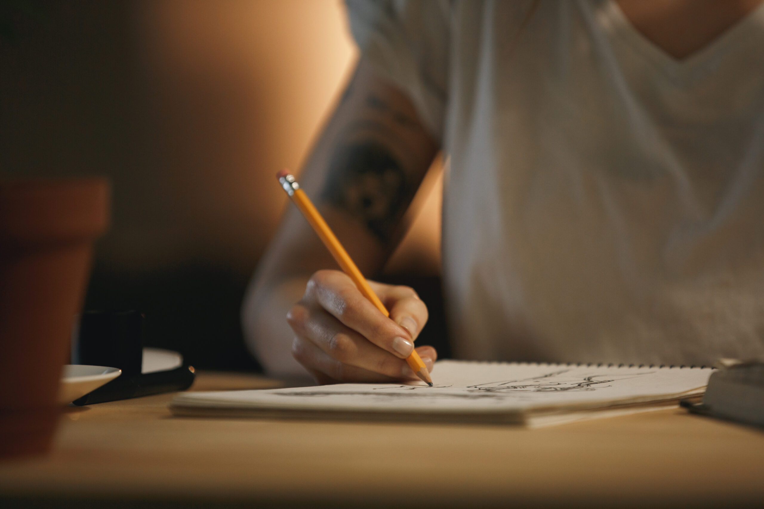 cropped photo of young woman designer writing notes.